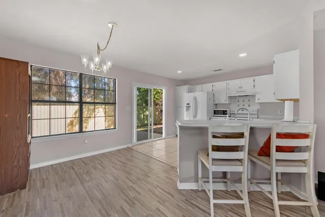 a kitchen with stainless steel appliances a stove top oven and cabinets