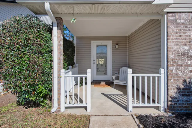 a view of two chairs in the balcony