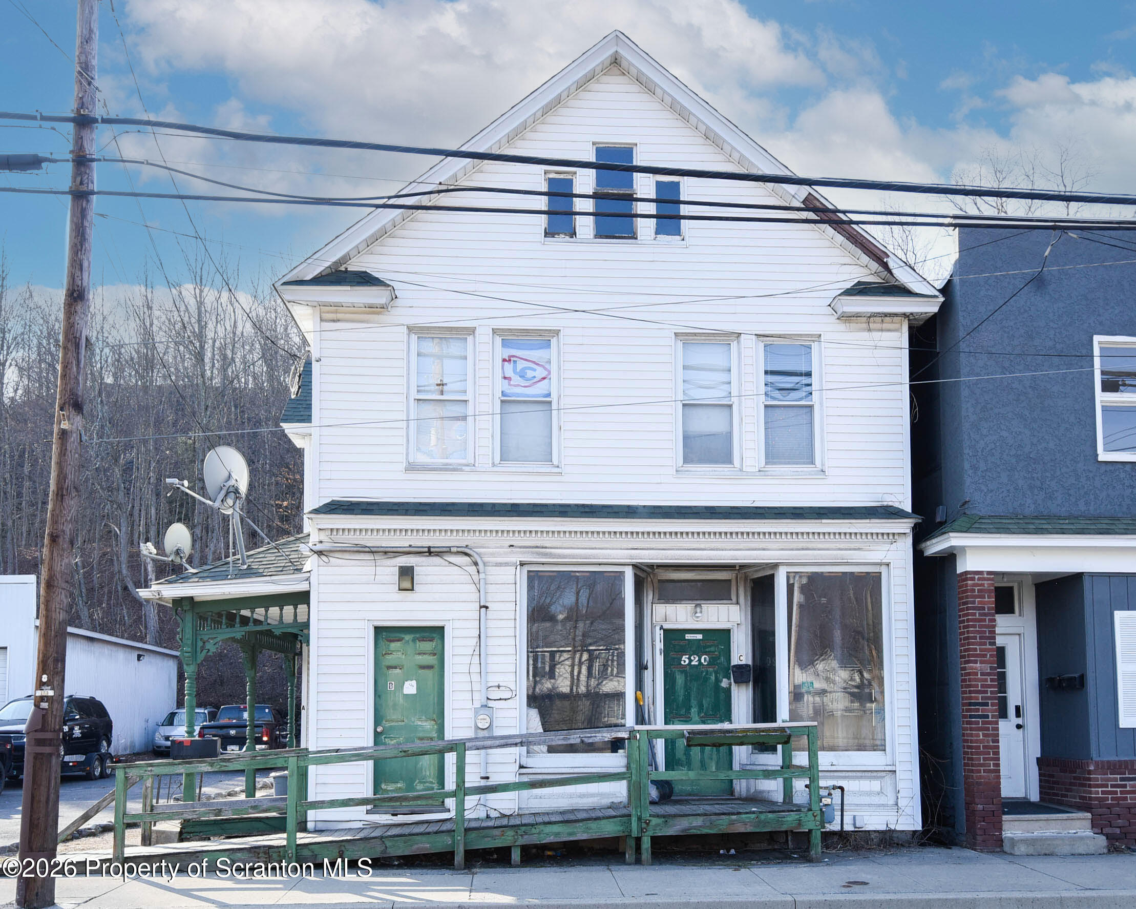 520 Main Street Archbald, PA 18403 - Photo 1 of 47 a front view of a house with glass windows