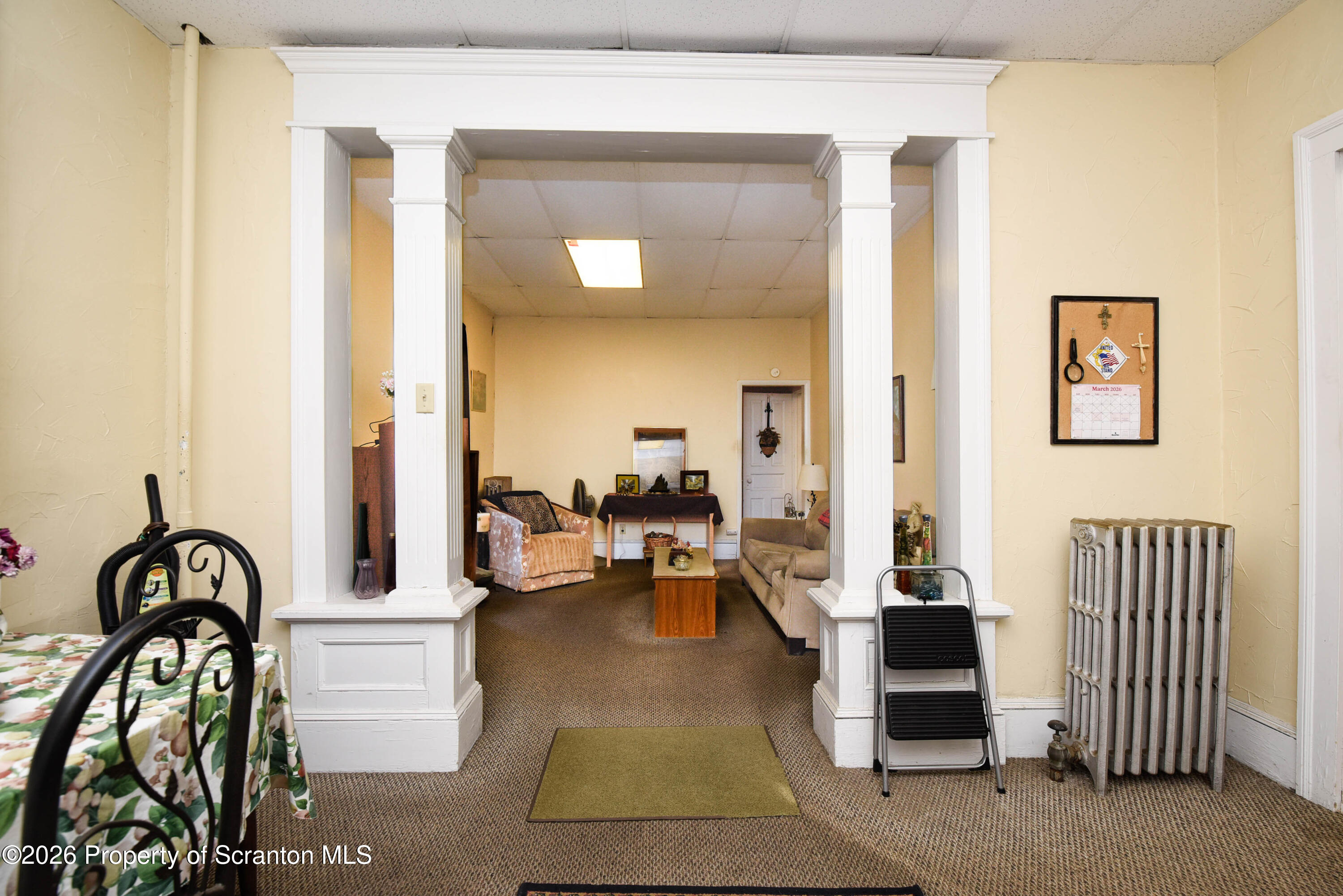 520 Main Street Archbald, PA 18403 - Photo 11 of 47 a living room with furniture and a window