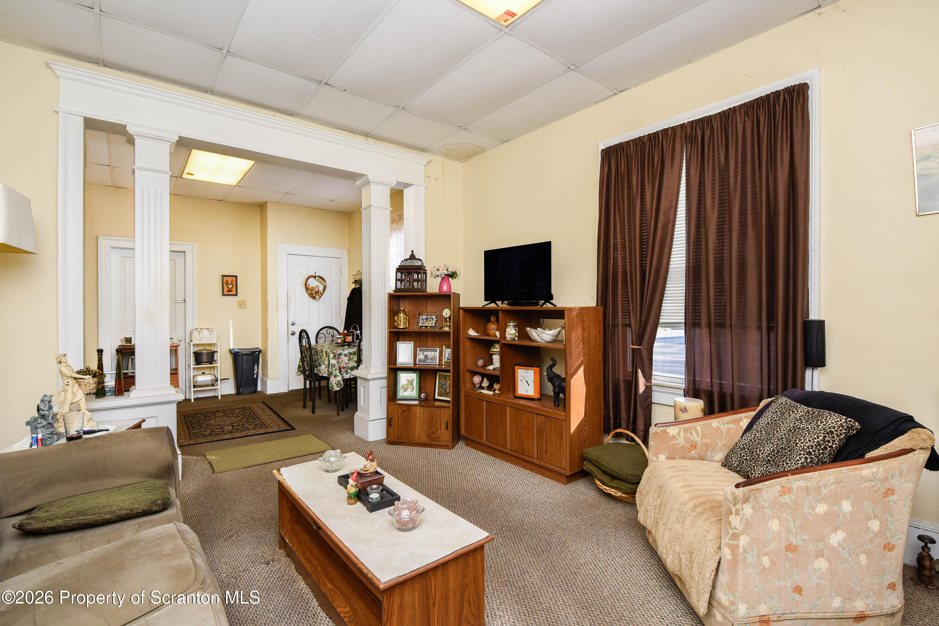 520 Main Street Archbald, PA 18403 - Photo 15 of 47 a living room with furniture and a flat screen tv