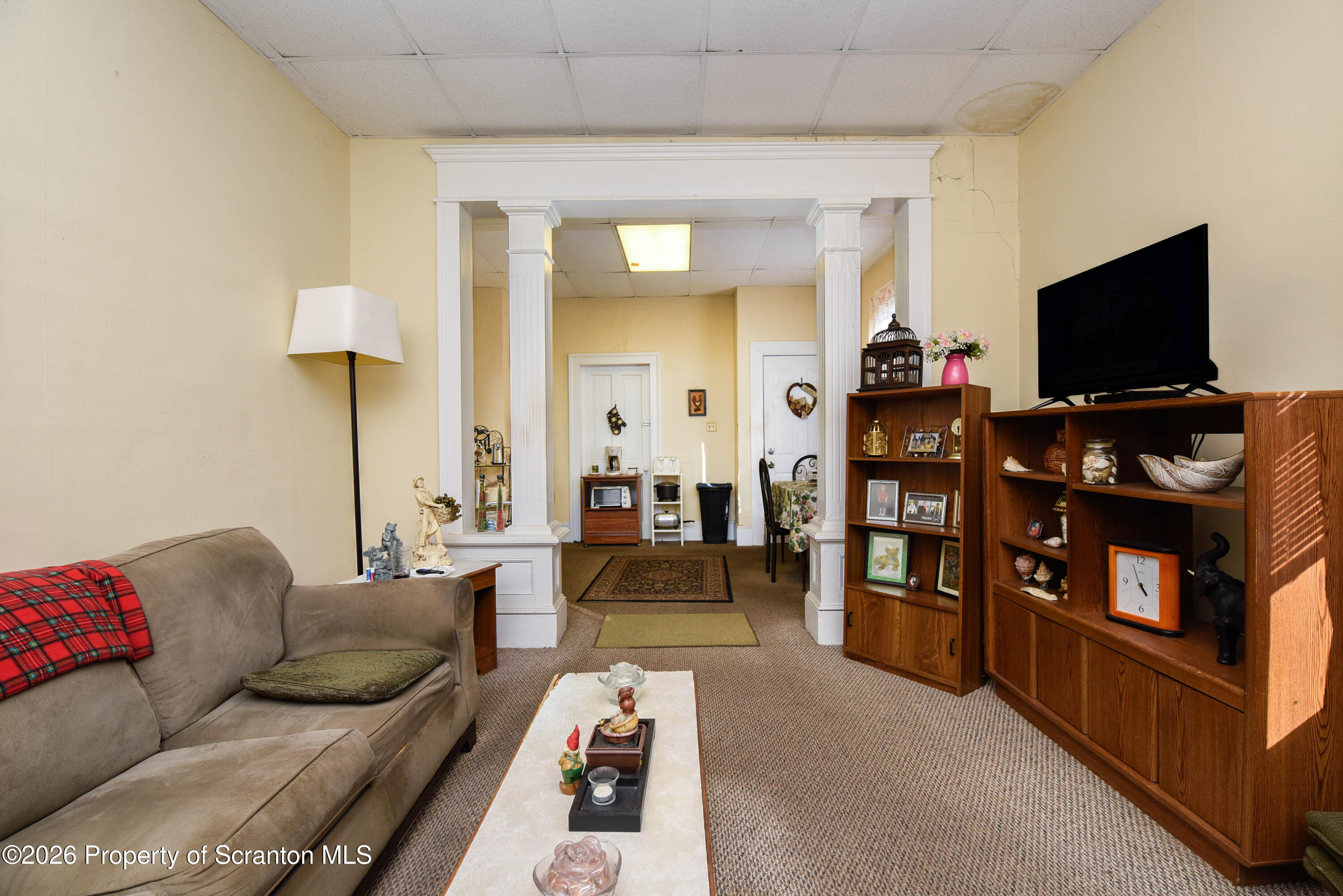 520 Main Street Archbald, PA 18403 - Photo 16 of 47 a living room with furniture and a flat screen tv