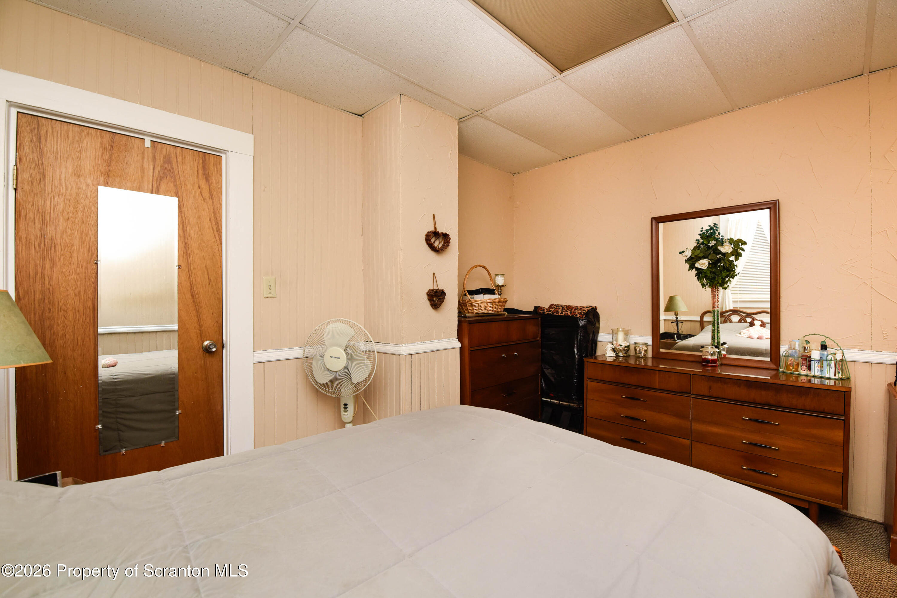 520 Main Street Archbald, PA 18403 - Photo 20 of 47 a bedroom with a bed and a dresser with mirror