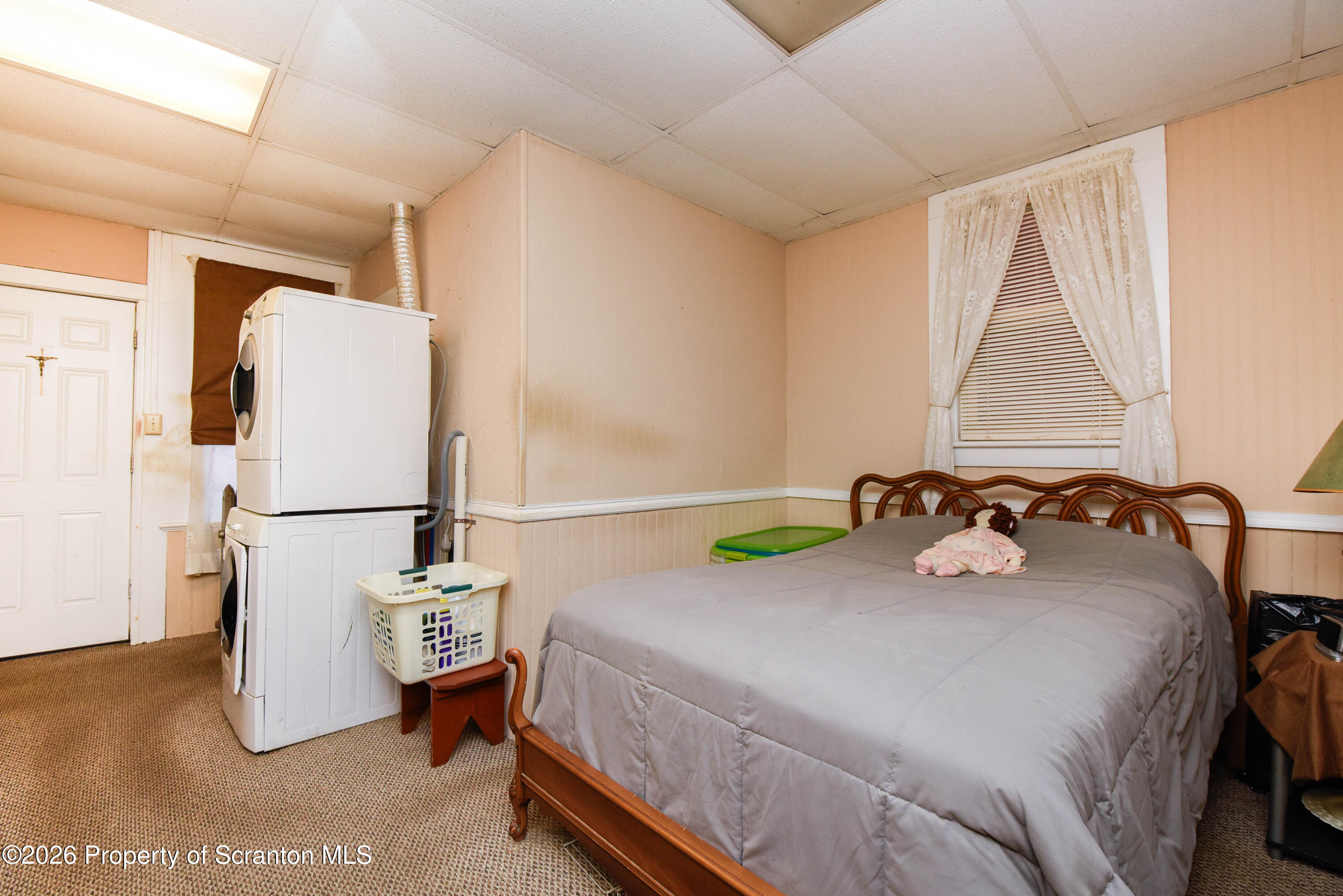 520 Main Street Archbald, PA 18403 - Photo 22 of 47 a bedroom with a bed and a refrigerator