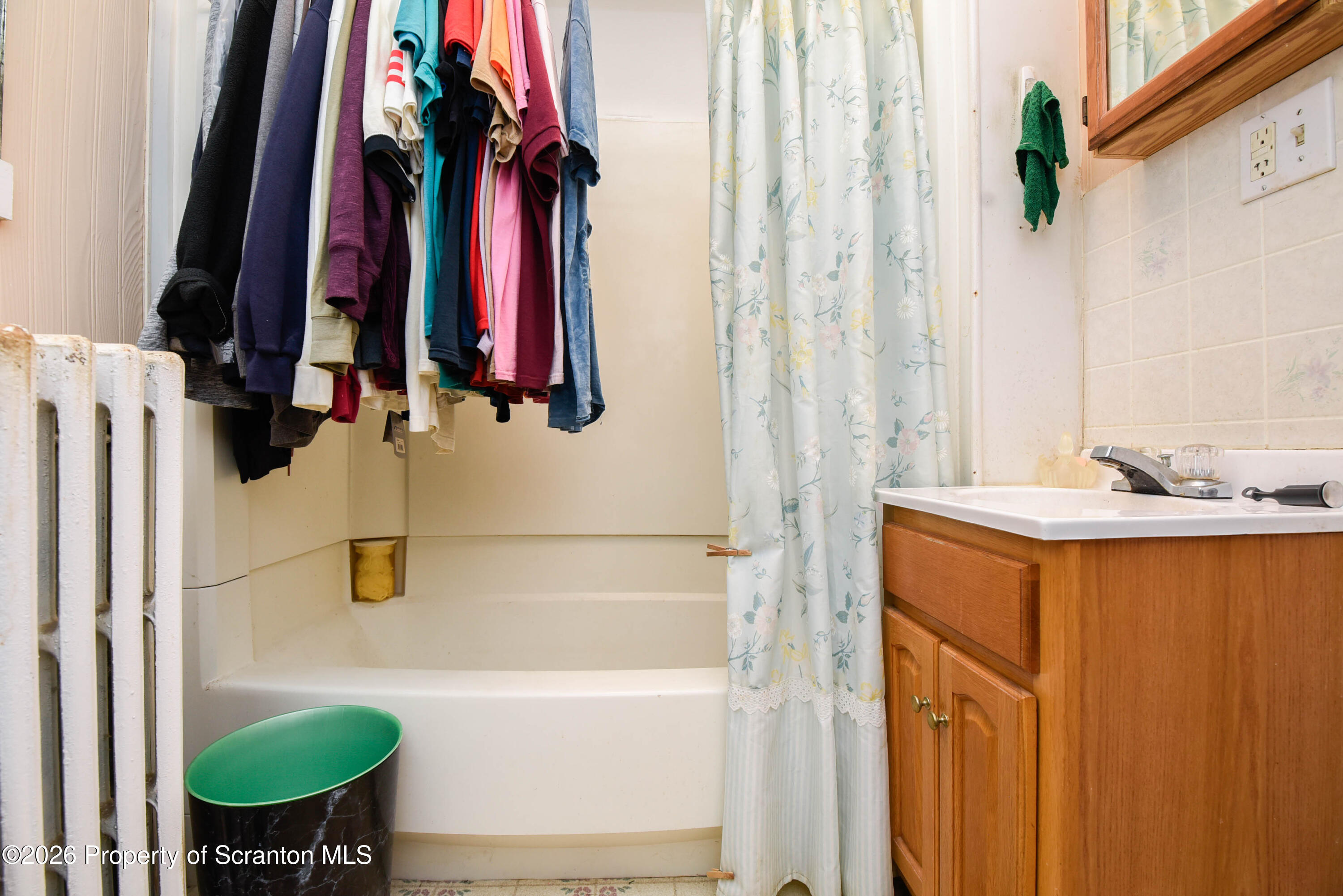 520 Main Street Archbald, PA 18403 - Photo 24 of 47 a bathroom with a tub sink and mirror
