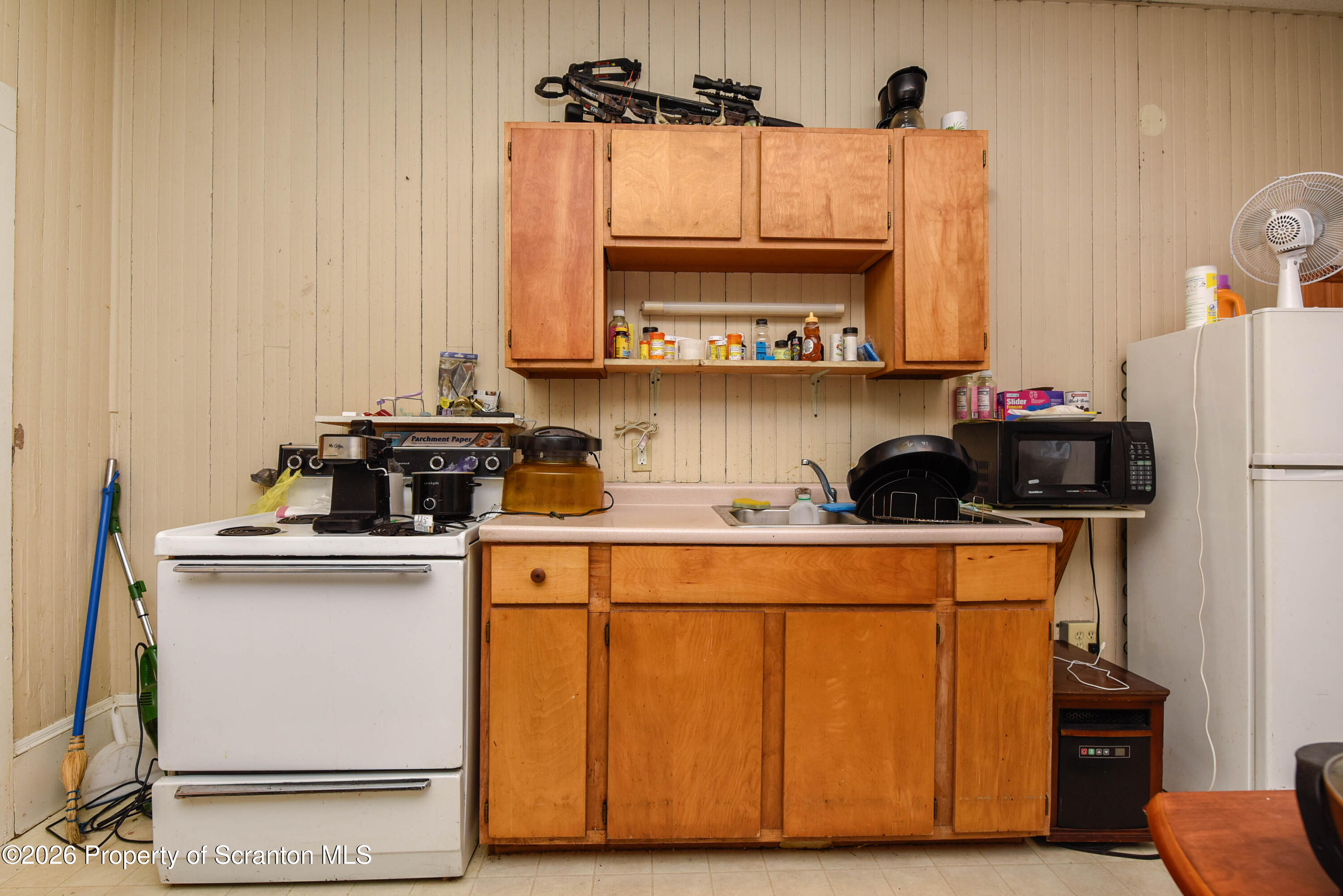 520 Main Street Archbald, PA 18403 - Photo 29 of 47 a kitchen with stainless steel appliances a sink and a refrigerator