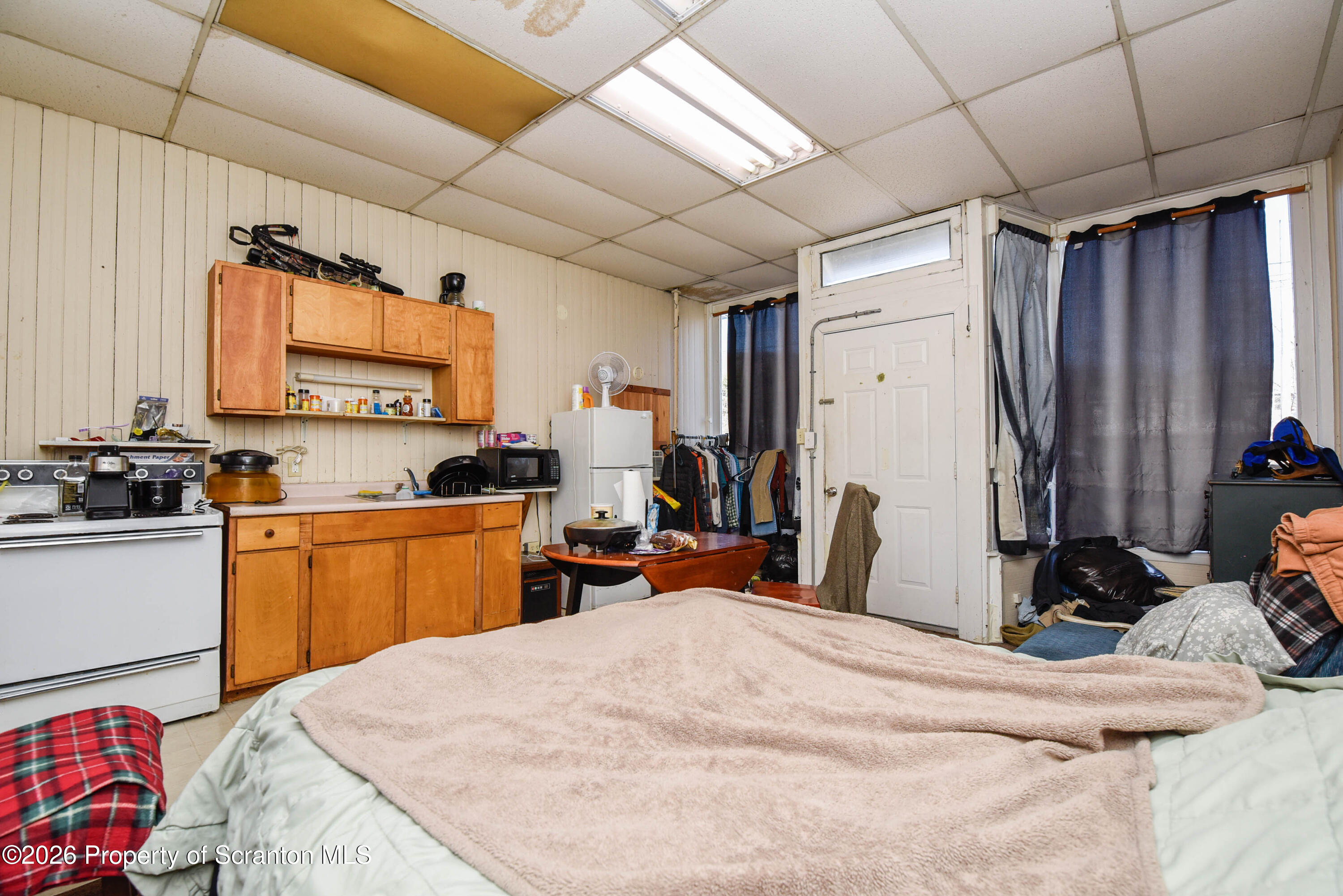 520 Main Street Archbald, PA 18403 - Photo 30 of 47 a bed room with a bed and a television