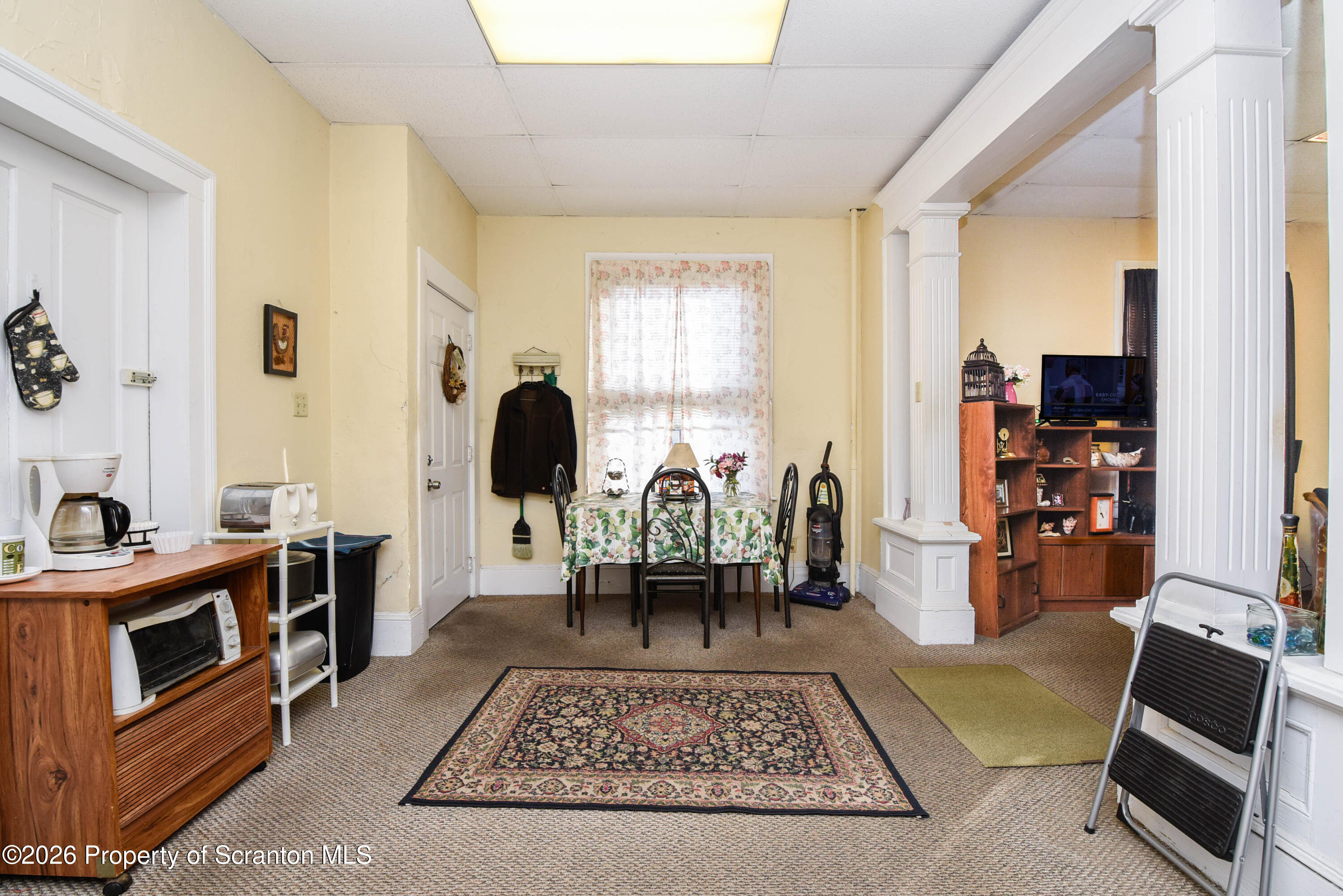 520 Main Street Archbald, PA 18403 - Photo 7 of 47 a living room with furniture and a fireplace