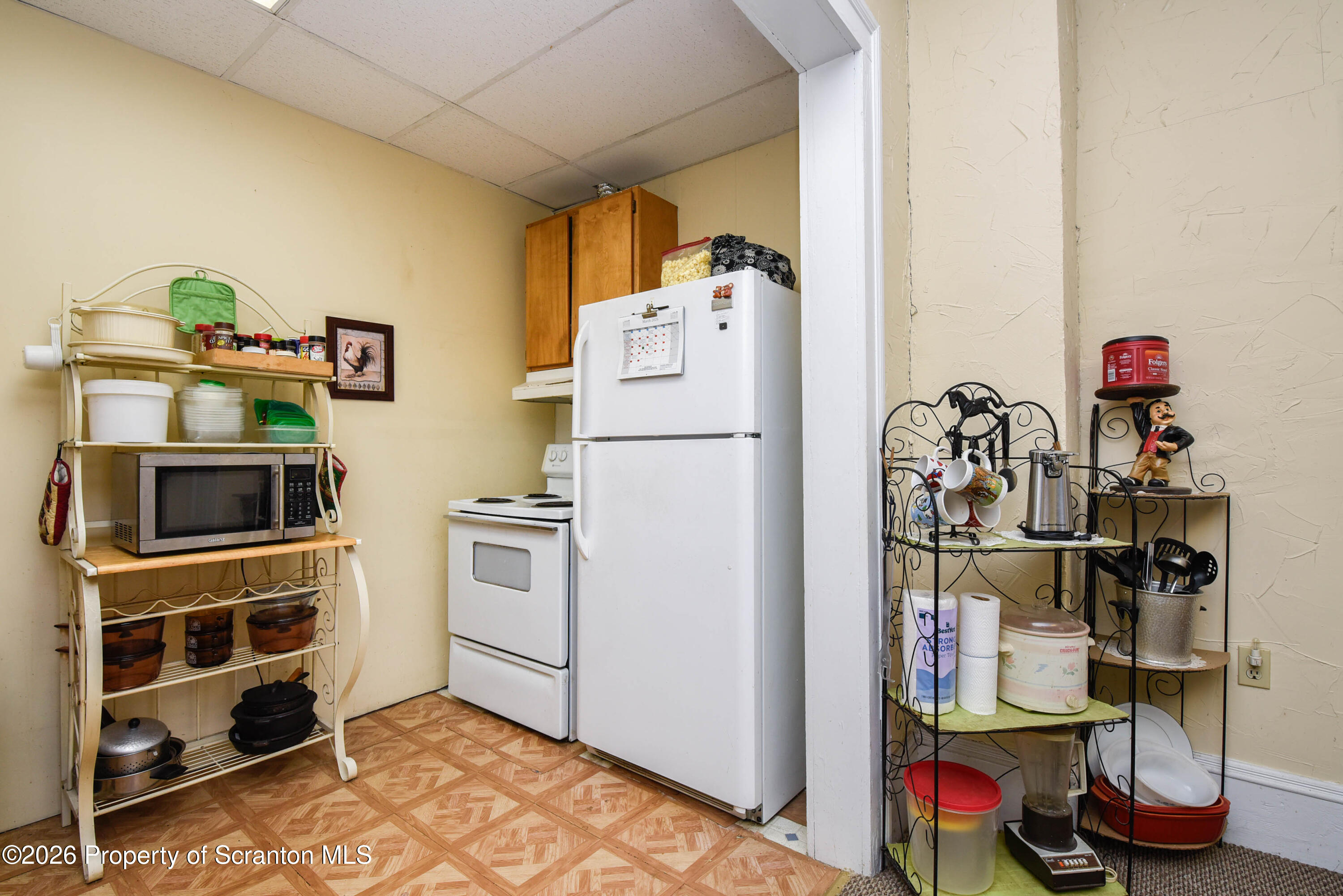 520 Main Street Archbald, PA 18403 - Photo 8 of 47 a kitchen with a refrigerator and cabinets
