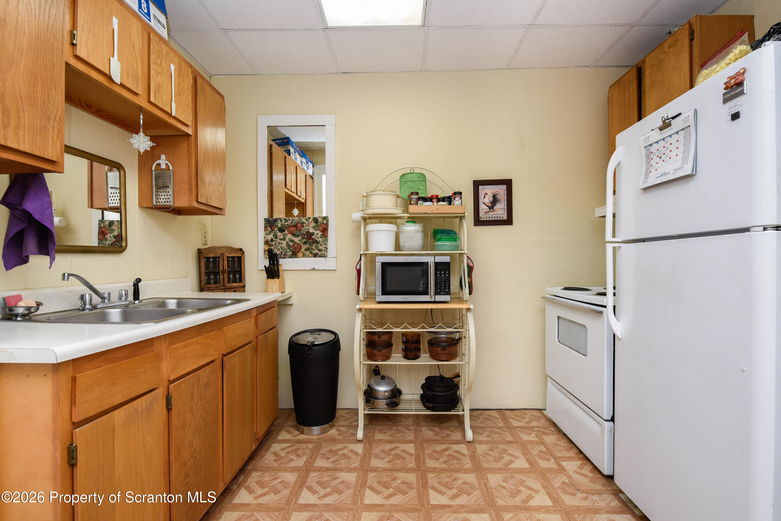 520 Main Street Archbald, PA 18403 - Photo 10 of 47 a kitchen with stainless steel appliances a refrigerator sink and white cabinets