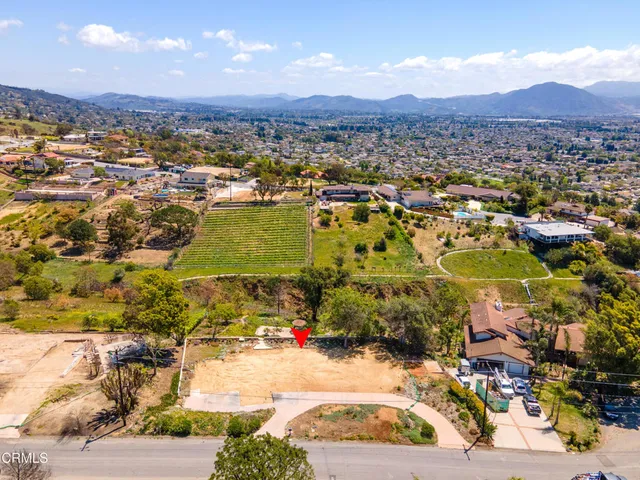 an aerial view of residential house and outdoor space
