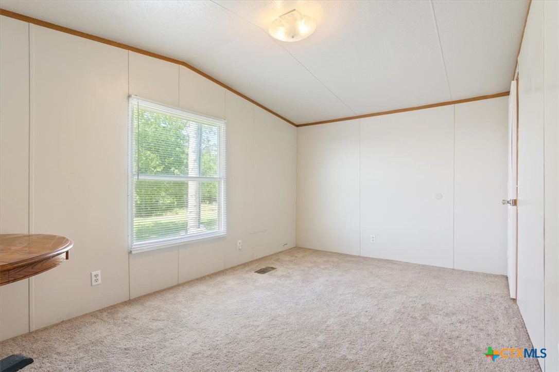 216 Moore Street Rogers, TX 76569 - Photo 16 of 29 an empty room with a window