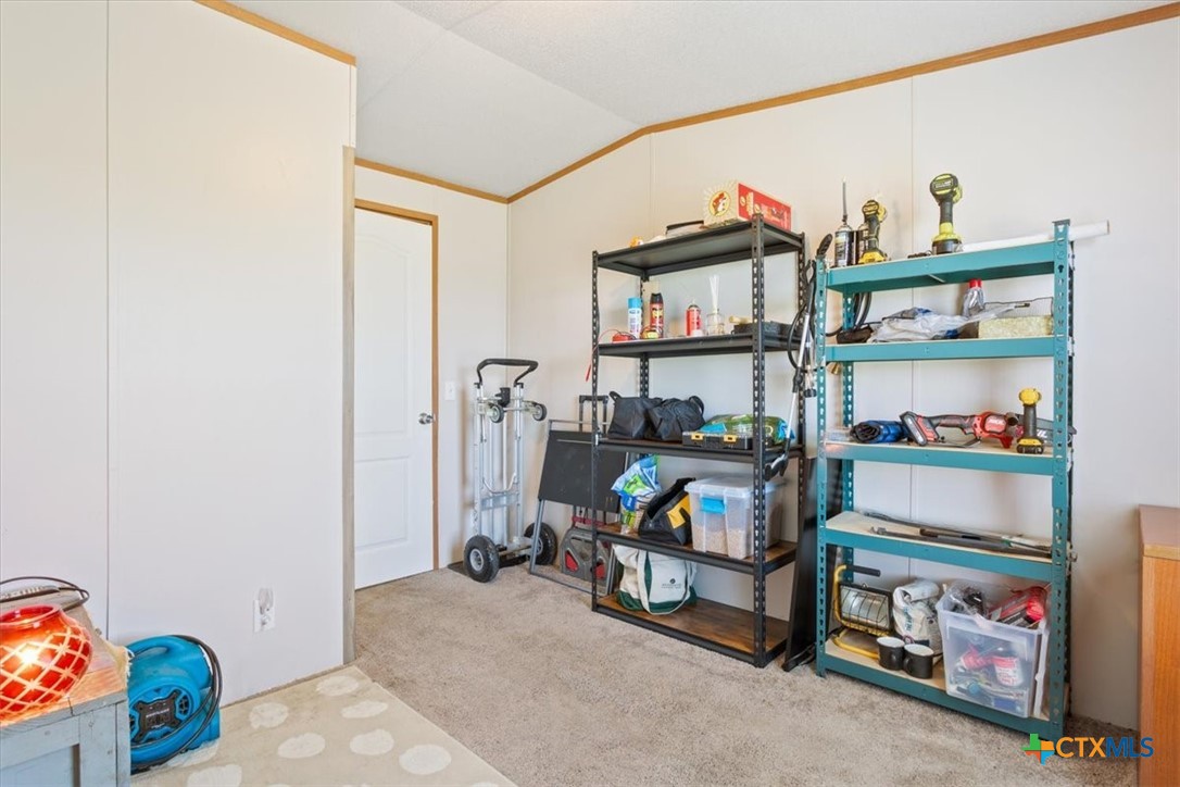 216 Moore Street Rogers, TX 76569 - Photo 19 of 29 a children room with toys and a book shelf
