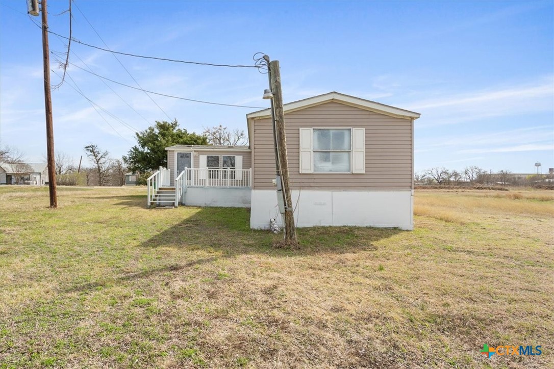 216 Moore Street Rogers, TX 76569 - Photo 4 of 29 a house view with a outdoor space