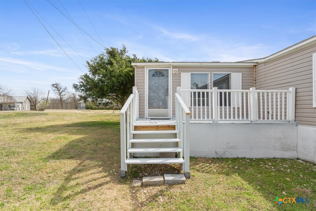 216 Moore Street Rogers, TX 76569 - Photo 5 of 29 a view of a house with a yard