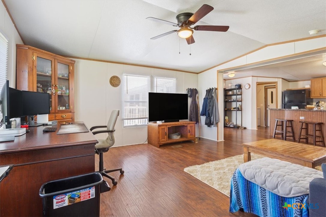 216 Moore Street Rogers, TX 76569 - Photo 7 of 29 a living room with furniture and a flat screen tv