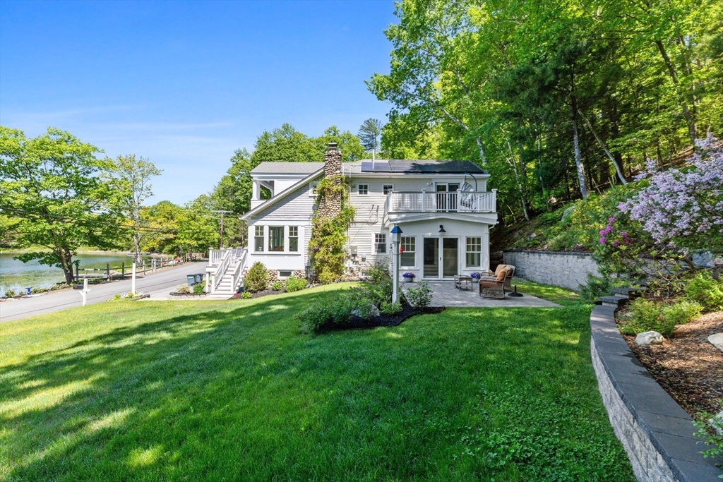 35 Keyes Road Westford, MA 01886 - Photo 38 of 40 a house with green field in front of it