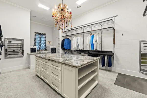 a kitchen with a sink and a mirror
