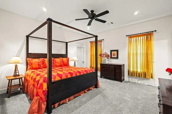 a bedroom with a bed and a baby crib