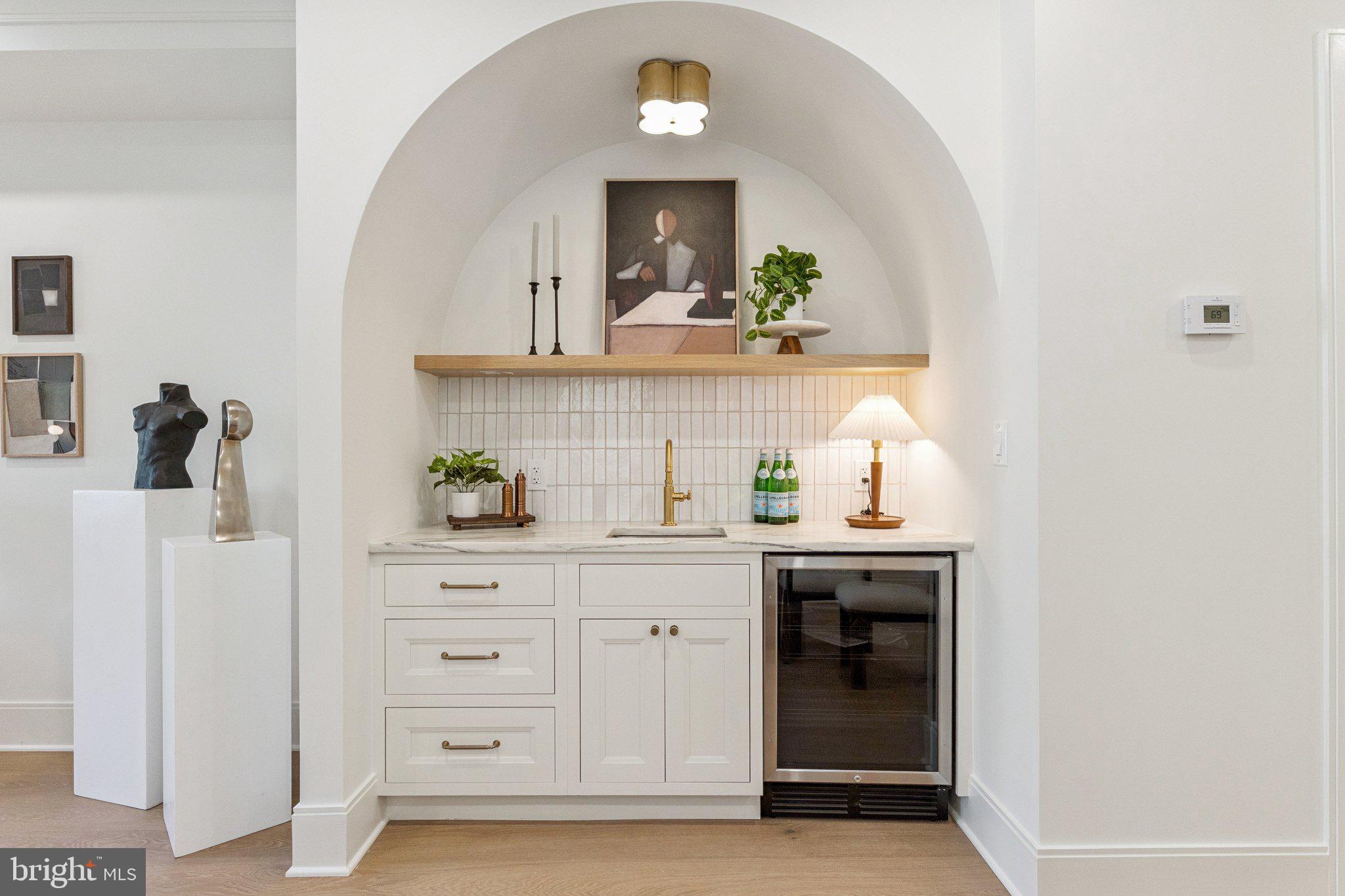 21 W Street Northwest Washington, DC 20001 - Photo 12 of 56 a kitchen with a sink and cabinets