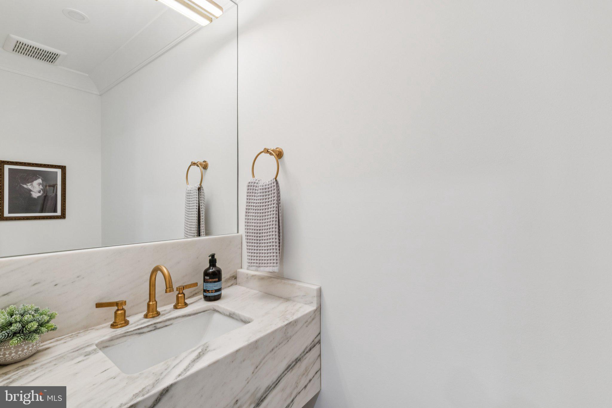 21 W Street Northwest Washington, DC 20001 - Photo 15 of 56 a bathroom with a sink and a mirror