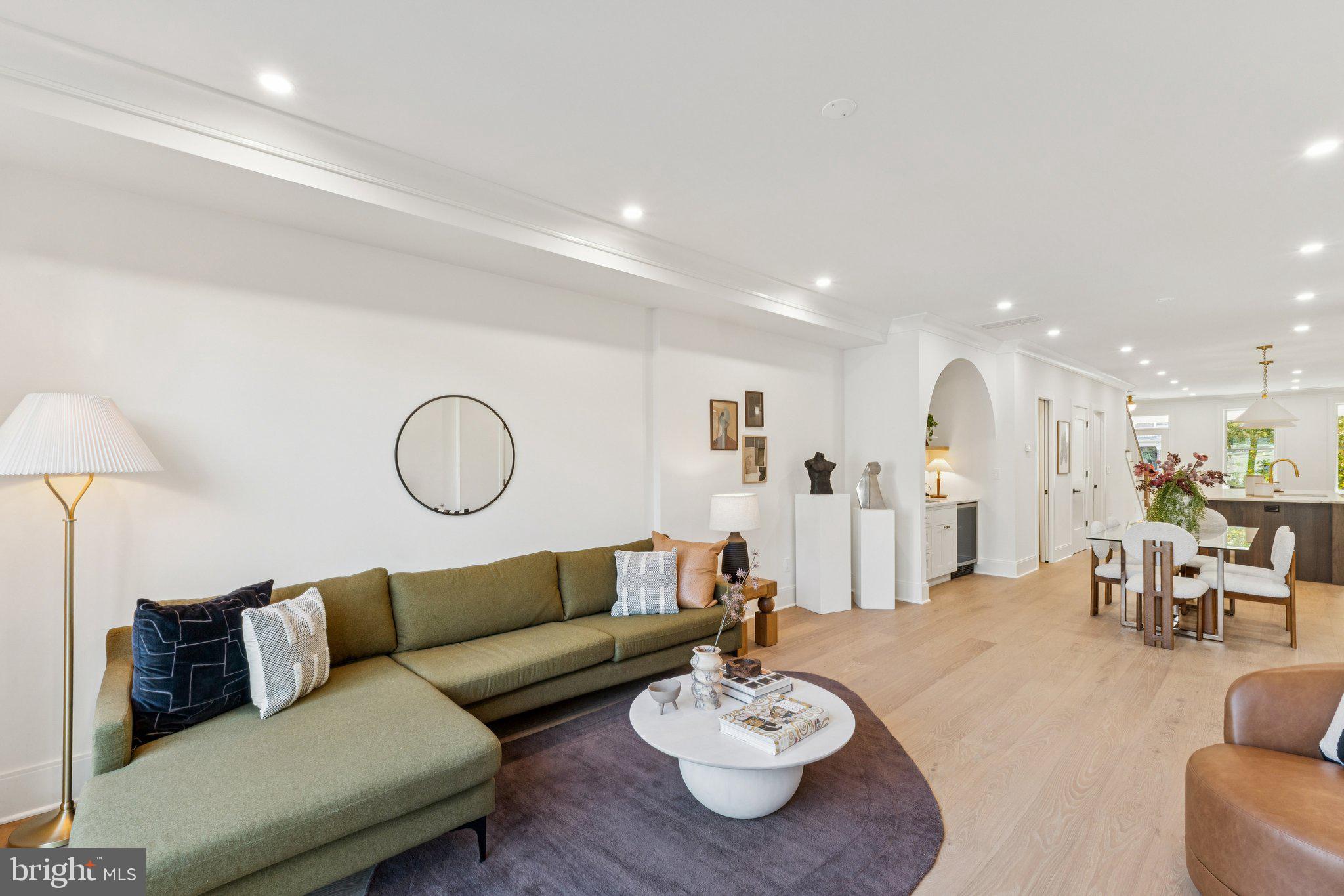 21 W Street Northwest Washington, DC 20001 - Photo 17 of 56 a living room with furniture kitchen view and a table