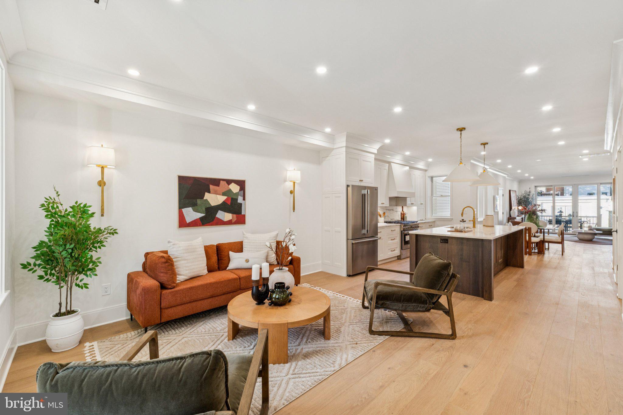 21 W Street Northwest Washington, DC 20001 - Photo 2 of 56 a living room with furniture and a view of kitchen
