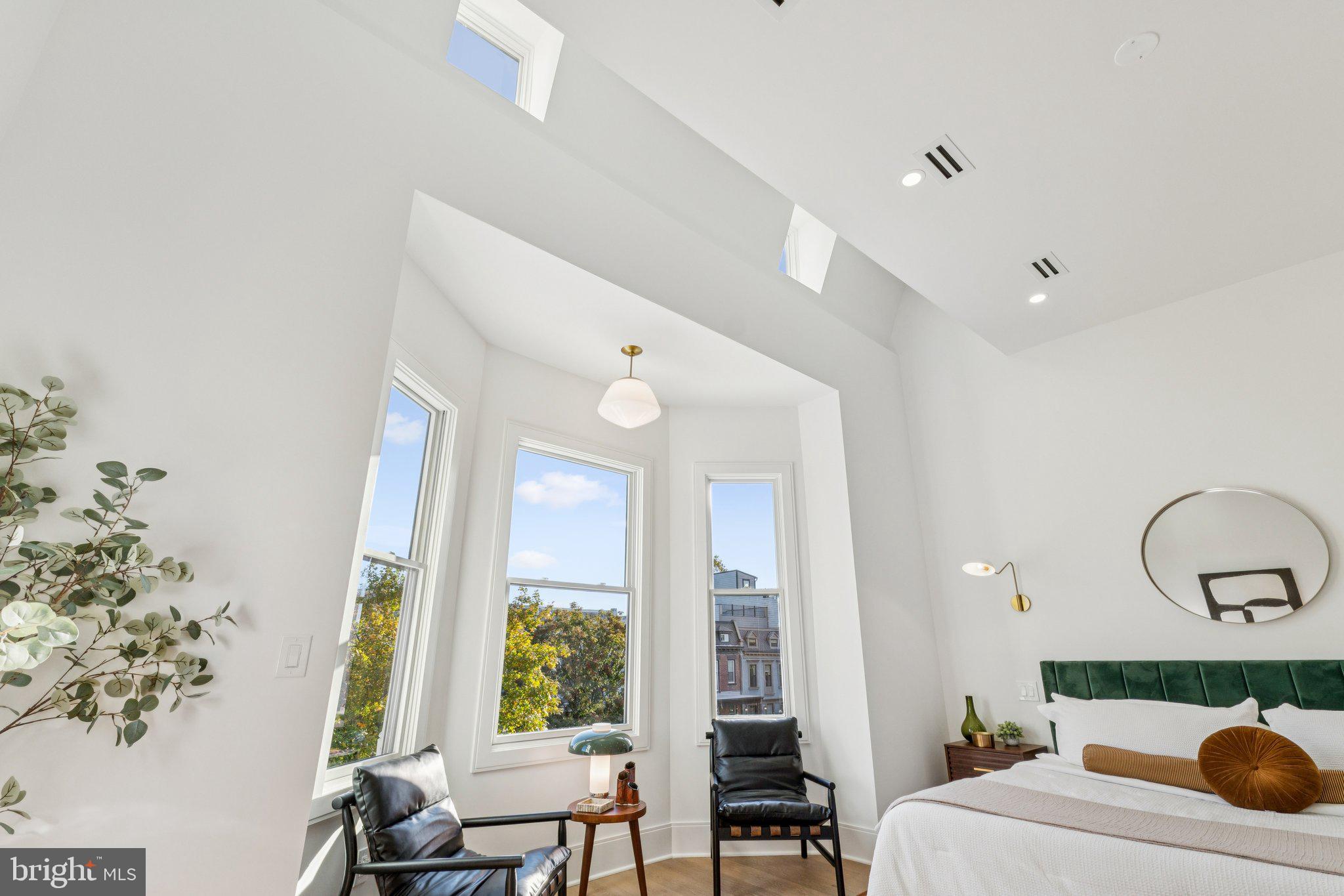 21 W Street Northwest Washington, DC 20001 - Photo 21 of 56 a living room with furniture and a floor to ceiling window