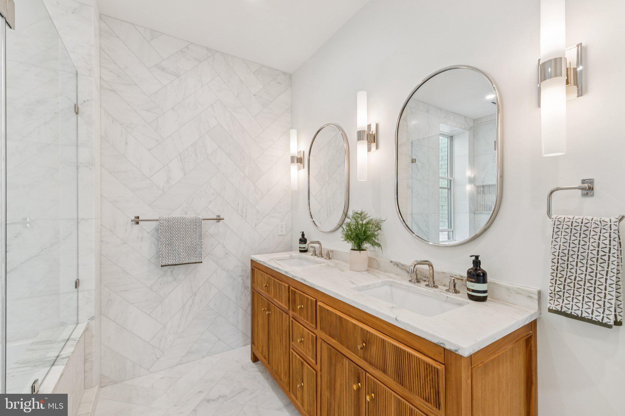 21 W Street Northwest Washington, DC 20001 - Photo 24 of 56 a bathroom with a sink and a mirror