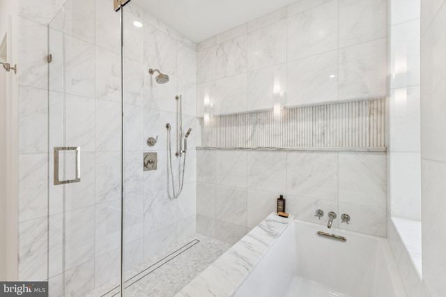 a view of a hallway with washer and dryer