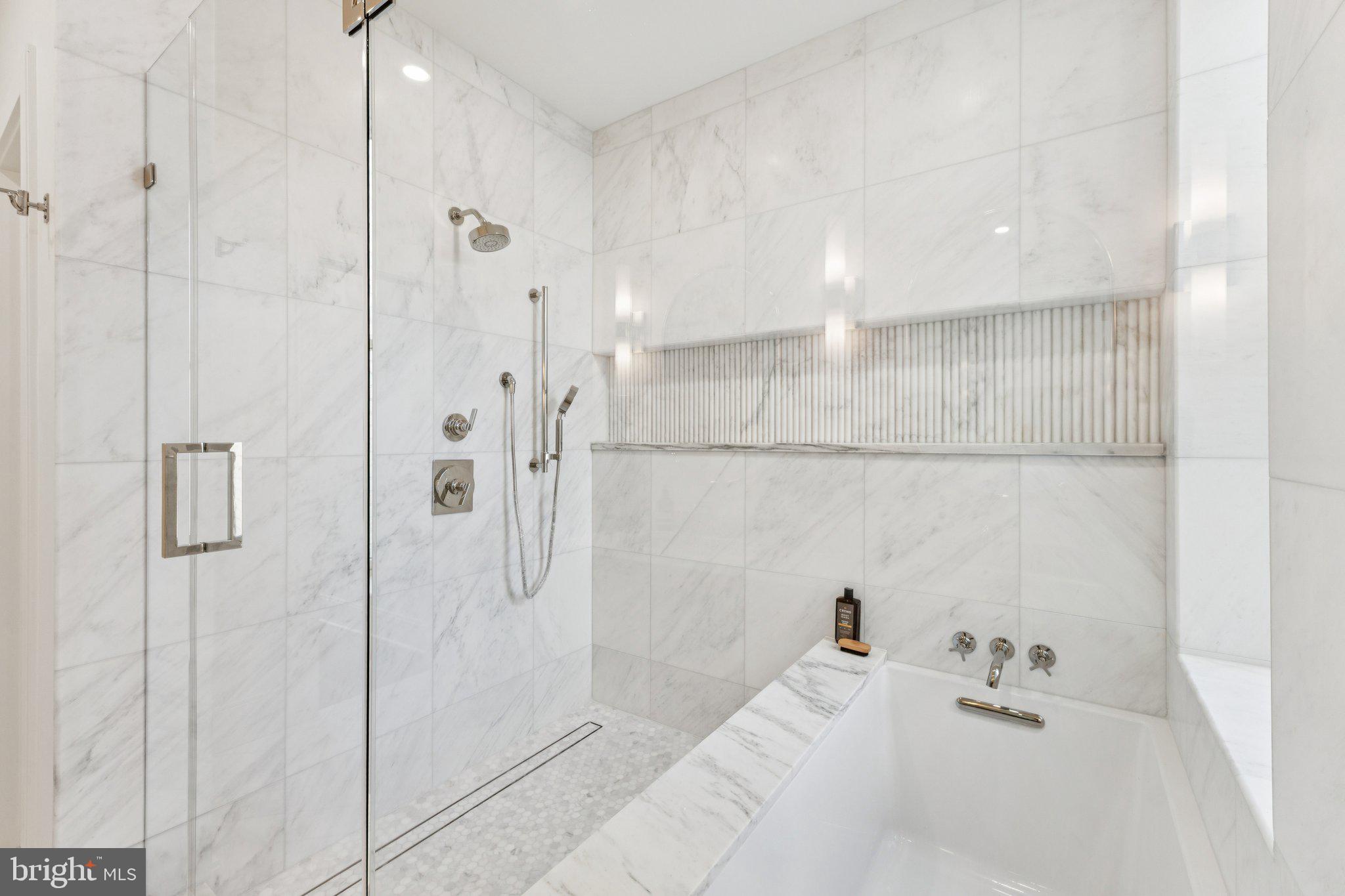 21 W Street Northwest Washington, DC 20001 - Photo 25 of 56 a bathroom with a bathtub and a shower