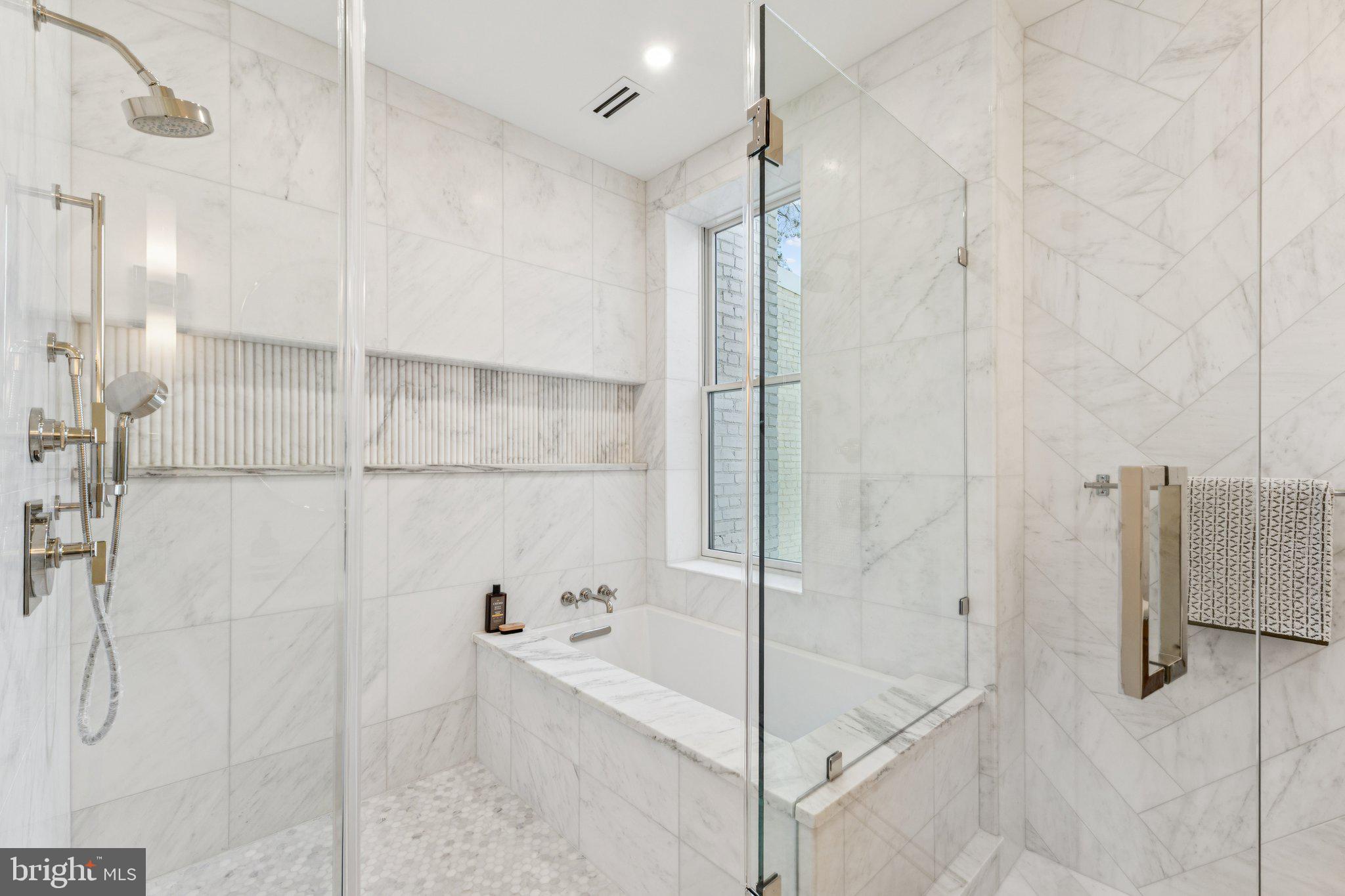 21 W Street Northwest Washington, DC 20001 - Photo 26 of 56 a bathroom with a bathtub and a shower