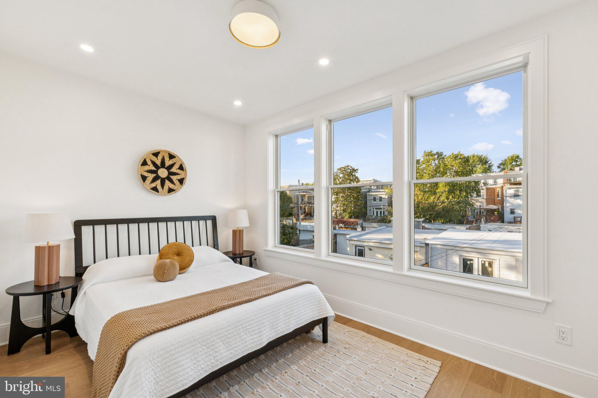 21 W Street Northwest Washington, DC 20001 - Photo 29 of 56 a bedroom with a bed and a large window