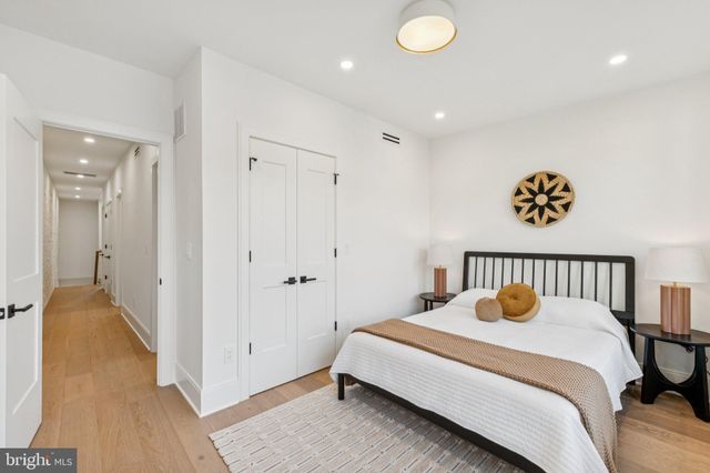 a bedroom with a bed and a chair