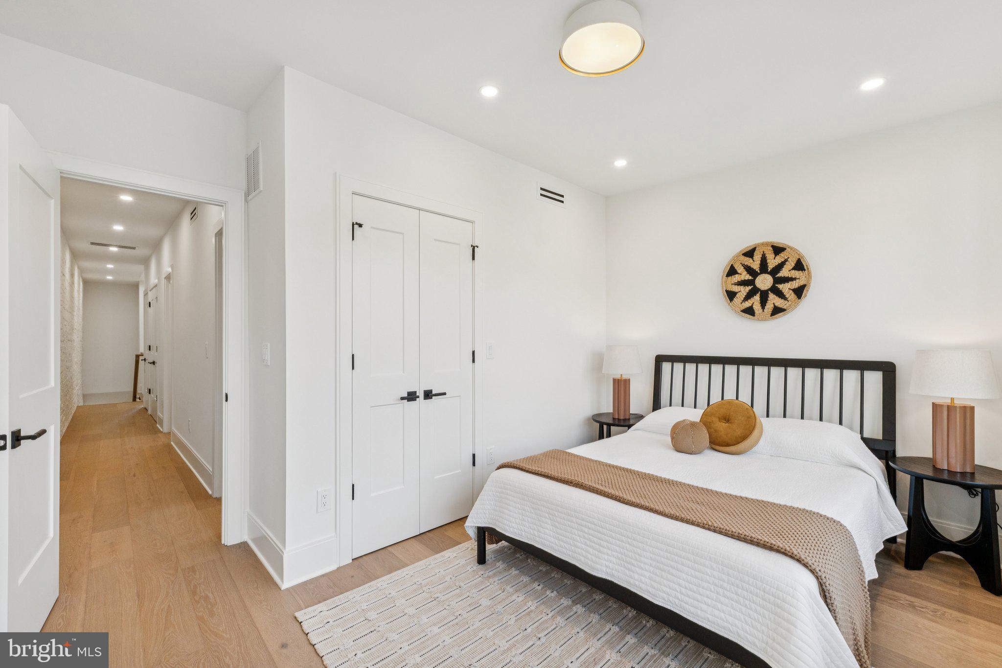 21 W Street Northwest Washington, DC 20001 - Photo 30 of 56 a bedroom with a bed and wooden floor