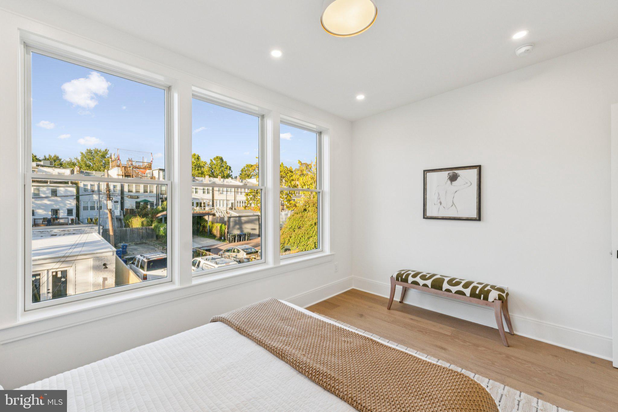 21 W Street Northwest Washington, DC 20001 - Photo 31 of 56 a bedroom with a bed and a large window