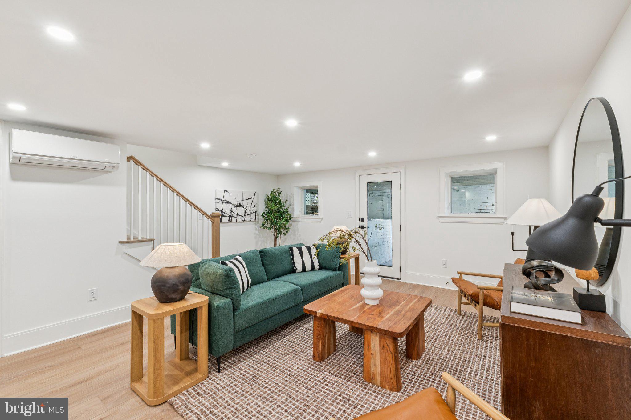 21 W Street Northwest Washington, DC 20001 - Photo 36 of 56 a living room with furniture and a flat screen tv