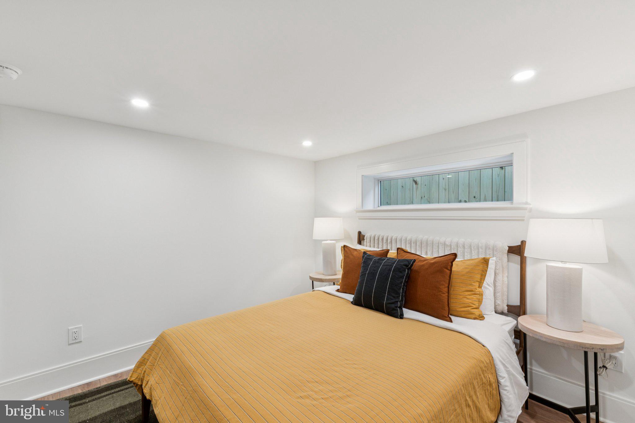 21 W Street Northwest Washington, DC 20001 - Photo 42 of 56 a bedroom with a bed and a night stand