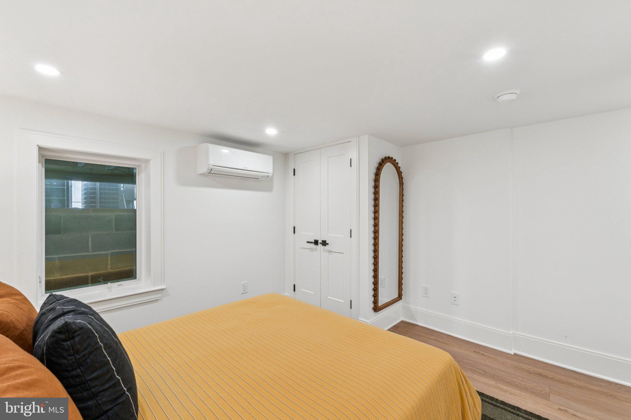 21 W Street Northwest Washington, DC 20001 - Photo 43 of 56 a bedroom with a bed and a window