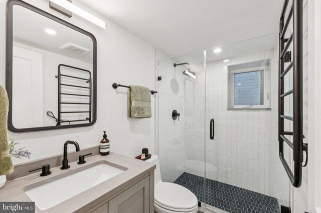 a view of a balcony with wooden floor and outdoor seating