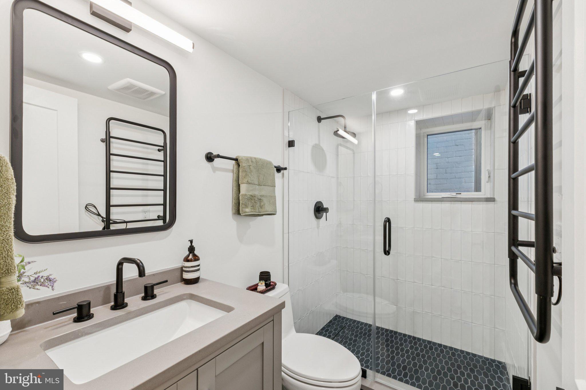 21 W Street Northwest Washington, DC 20001 - Photo 44 of 56 a bathroom with a sink toilet and shower