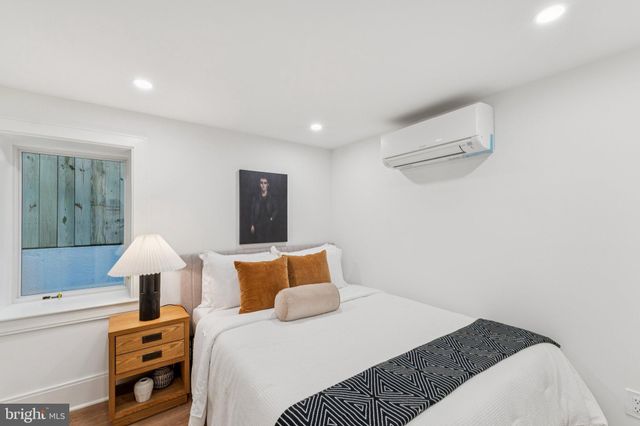 a view of a patio with table and chairs and potted plants