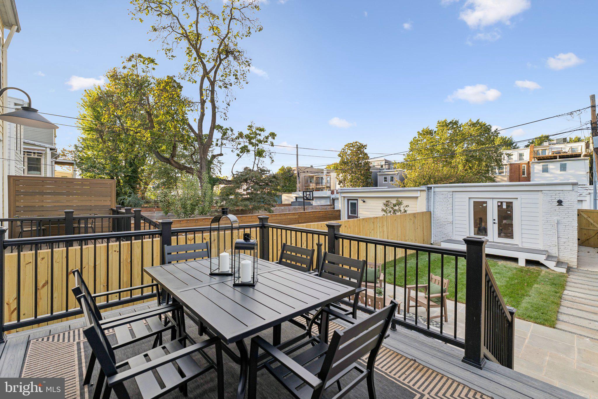 21 W Street Northwest Washington, DC 20001 - Photo 49 of 56 a view of a balcony with wooden floor and outdoor seating