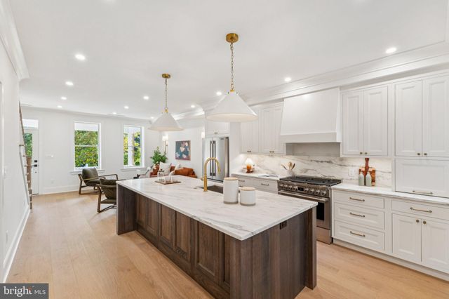 a very nice looking dining room with a large window