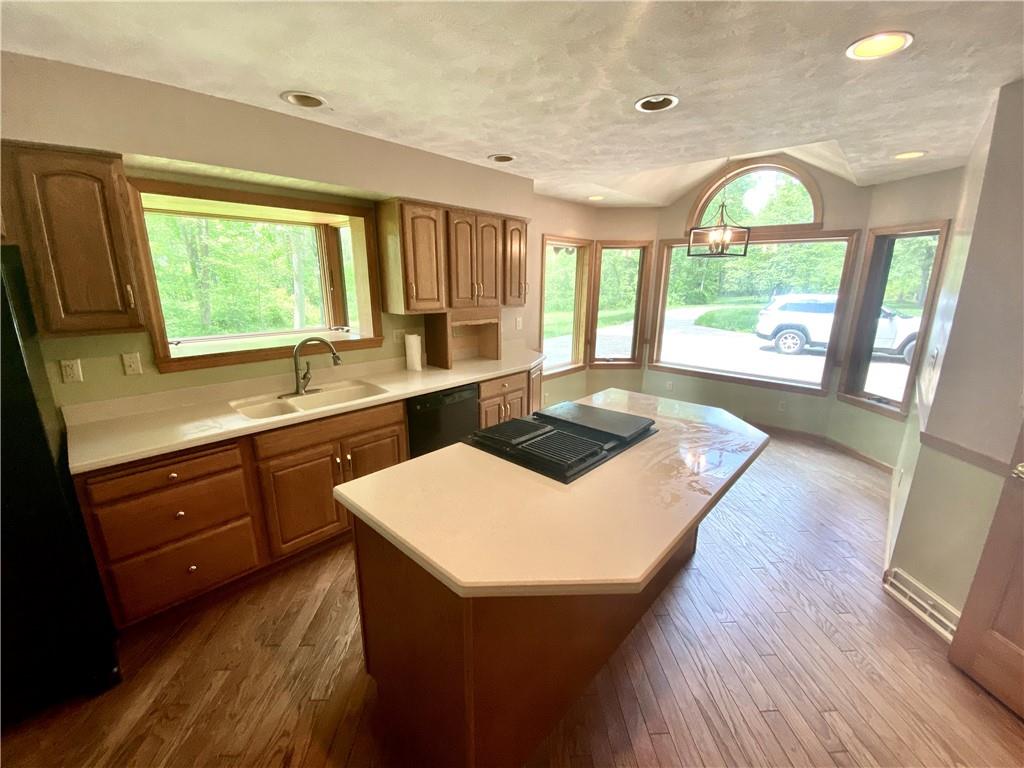 201 Curfew Road Perryopolis, PA 15473 - Photo 13 of 25 a kitchen with a sink a large window and wooden floor