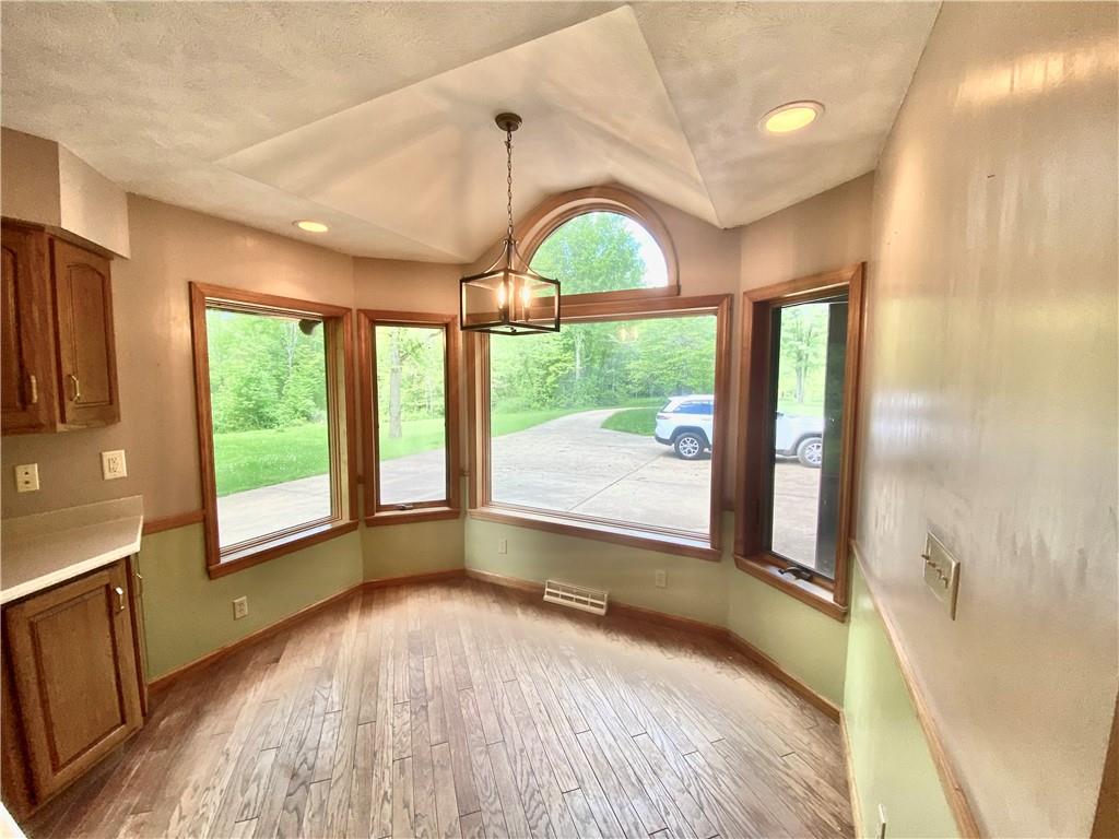 201 Curfew Road Perryopolis, PA 15473 - Photo 14 of 25 a view of an entryway with a floor to ceiling window and wooden floor