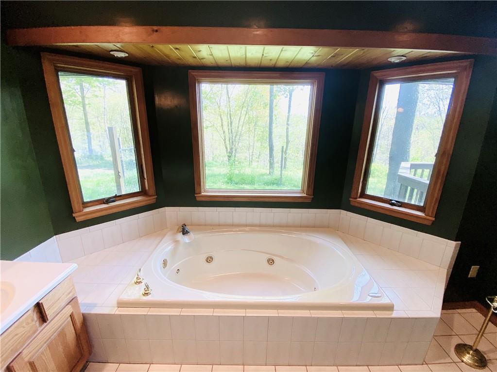 201 Curfew Road Perryopolis, PA 15473 - Photo 17 of 25 a bathroom with a bathtub and a window