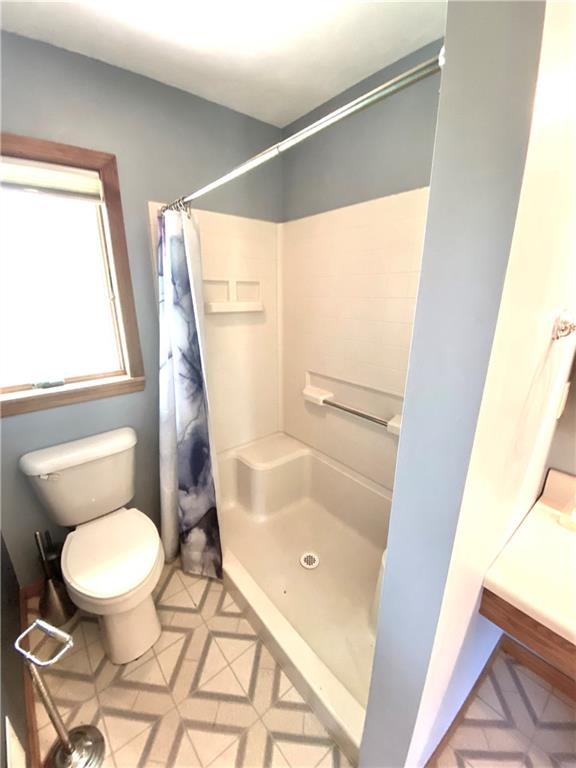 201 Curfew Road Perryopolis, PA 15473 - Photo 19 of 25 a bathroom with a toilet and a shower