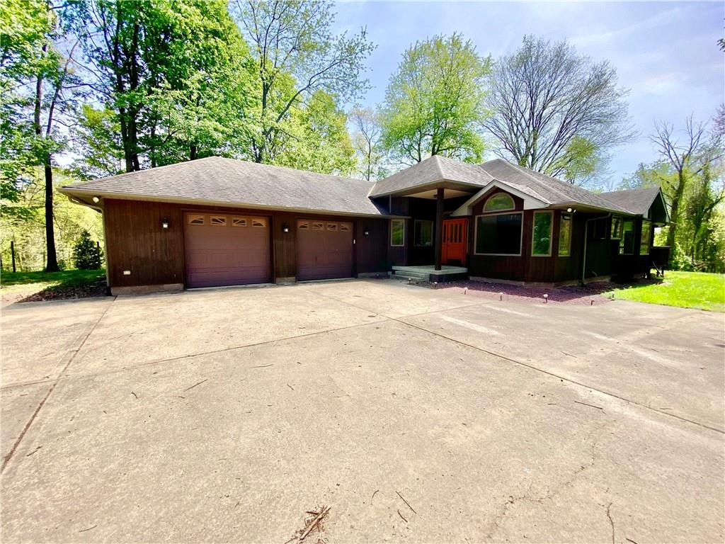 201 Curfew Road Perryopolis, PA 15473 - Photo 2 of 25 a front view of a house with a garden
