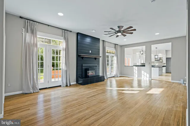 a view of a livingroom with a ceiling fan and window